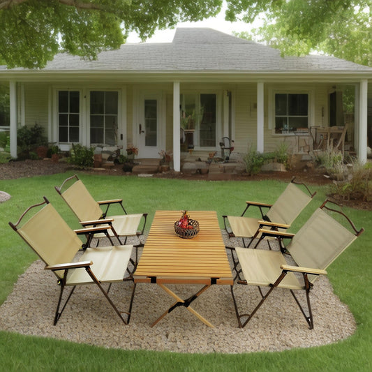 Canvas camping chairs with wooden armrests and folding metal frames surround a slatted wood picnic table