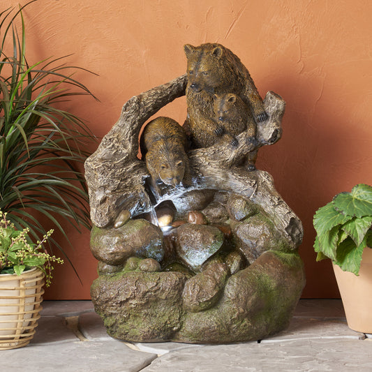 Brown resin bear family fountain with cascading water over rocks