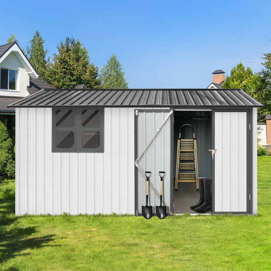 White metal garden shed with dark grey trim and roof featuring two shovels