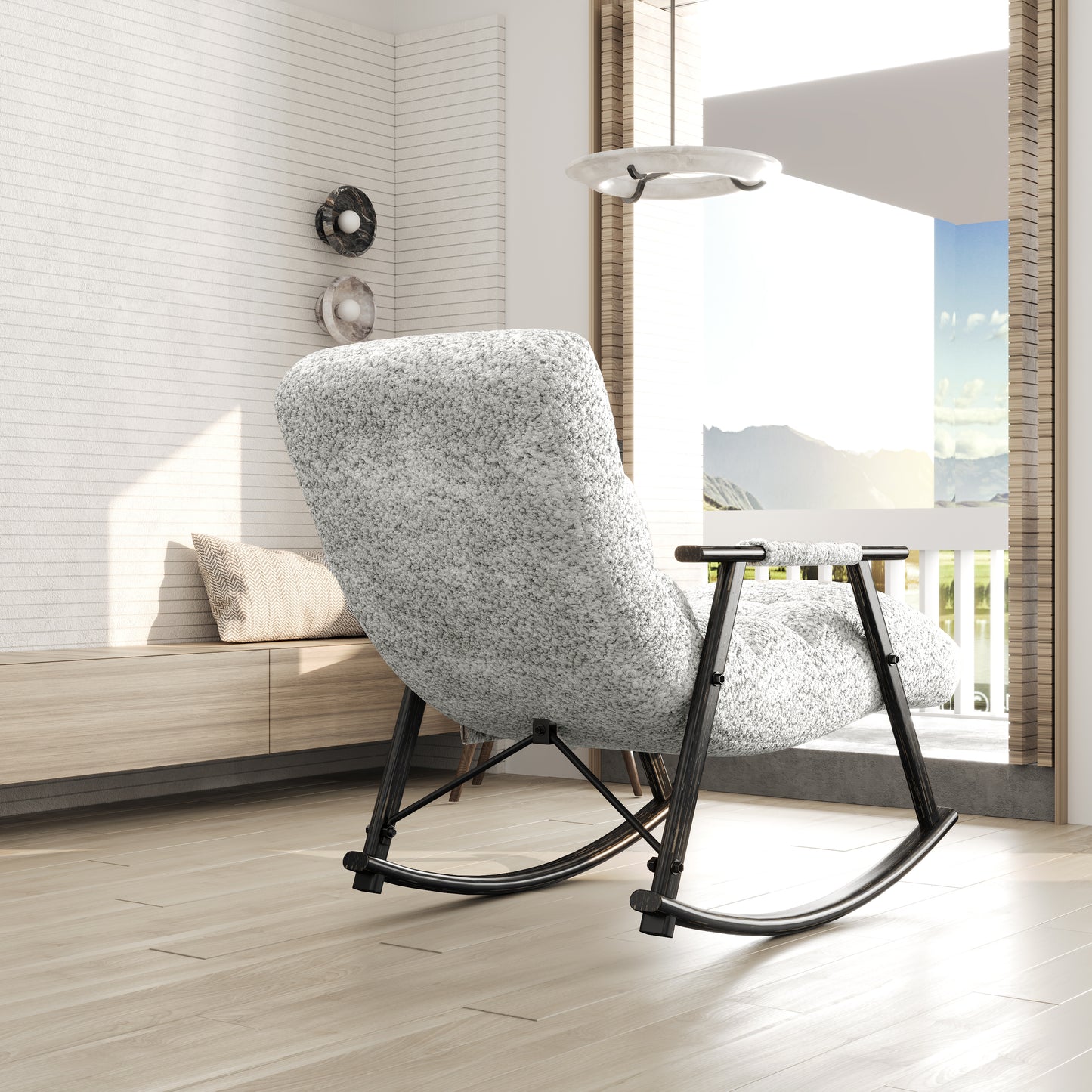 Textured gray upholstered rocking chair with black metal frame a stylish accent for living rooms