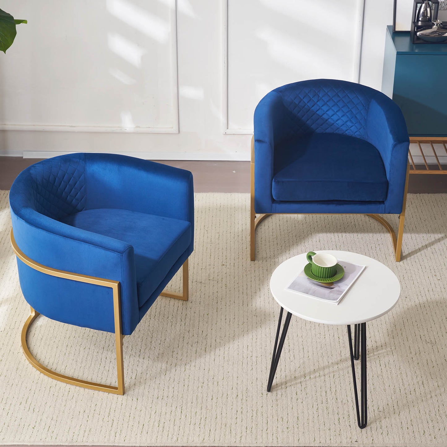 Royal blue velvet accent chair with diamond tufting and gold metal legs
