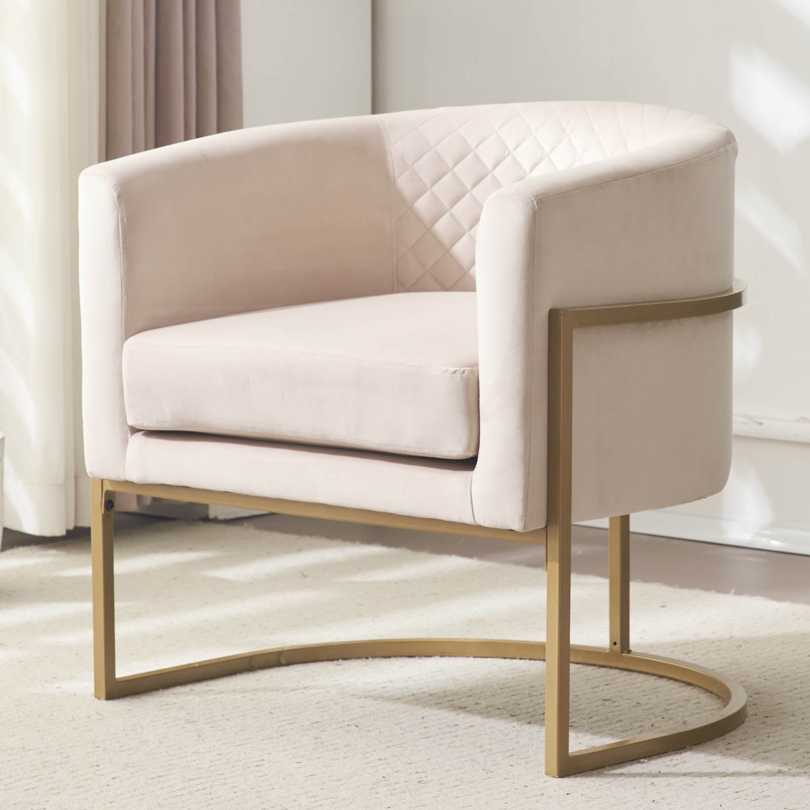 Champagne velvet accent chair with diamond tufting and gold metal legs