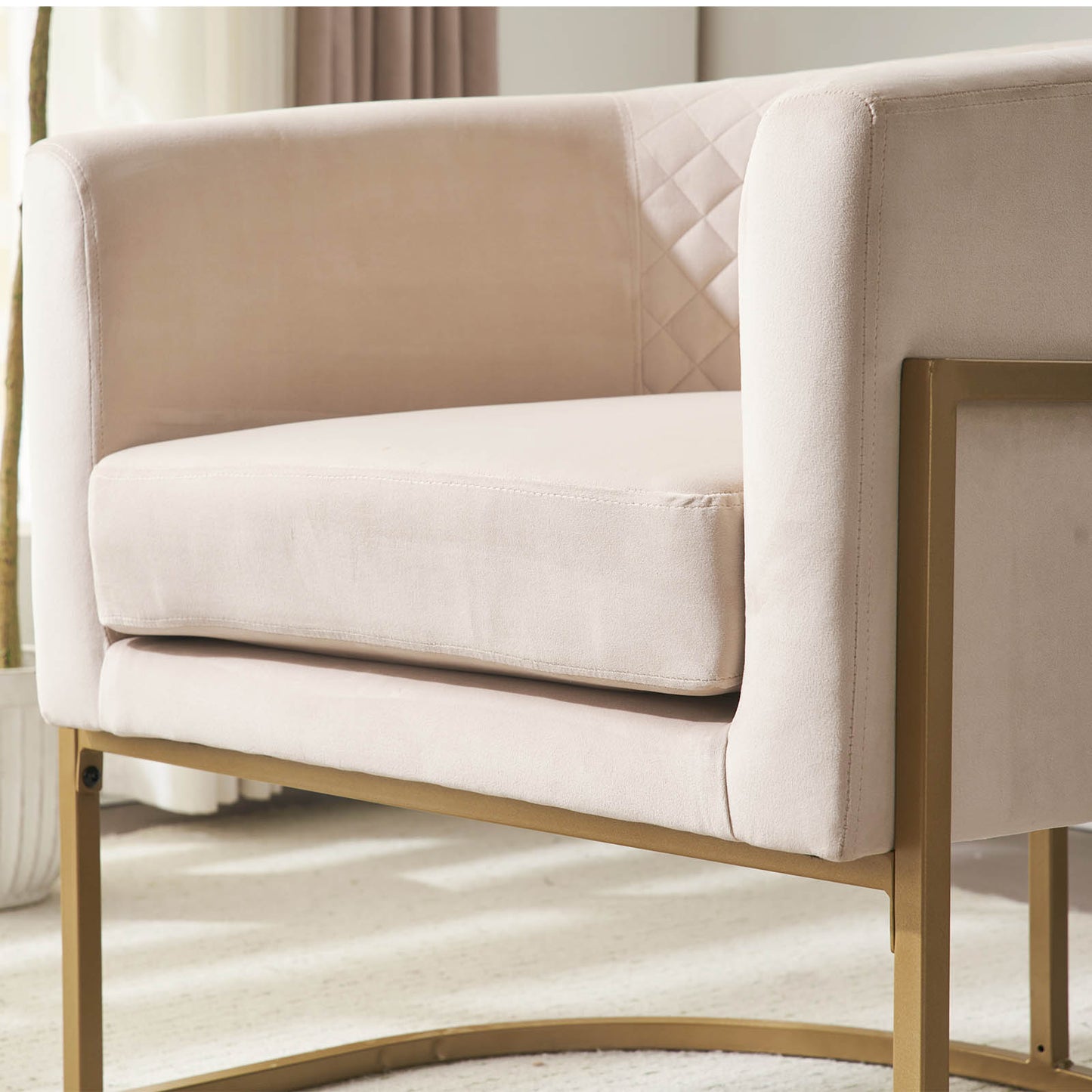 Beige velvet accent chair with diamond tufted back and gold metal frame