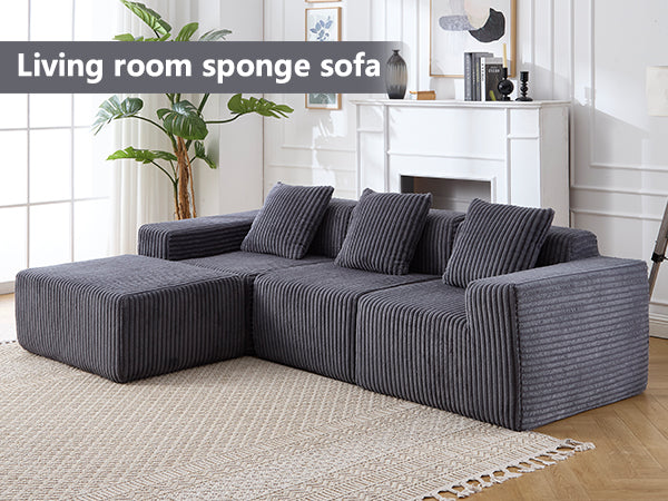 Dark gray corduroy sectional sofa with matching ottoman for a modern living room