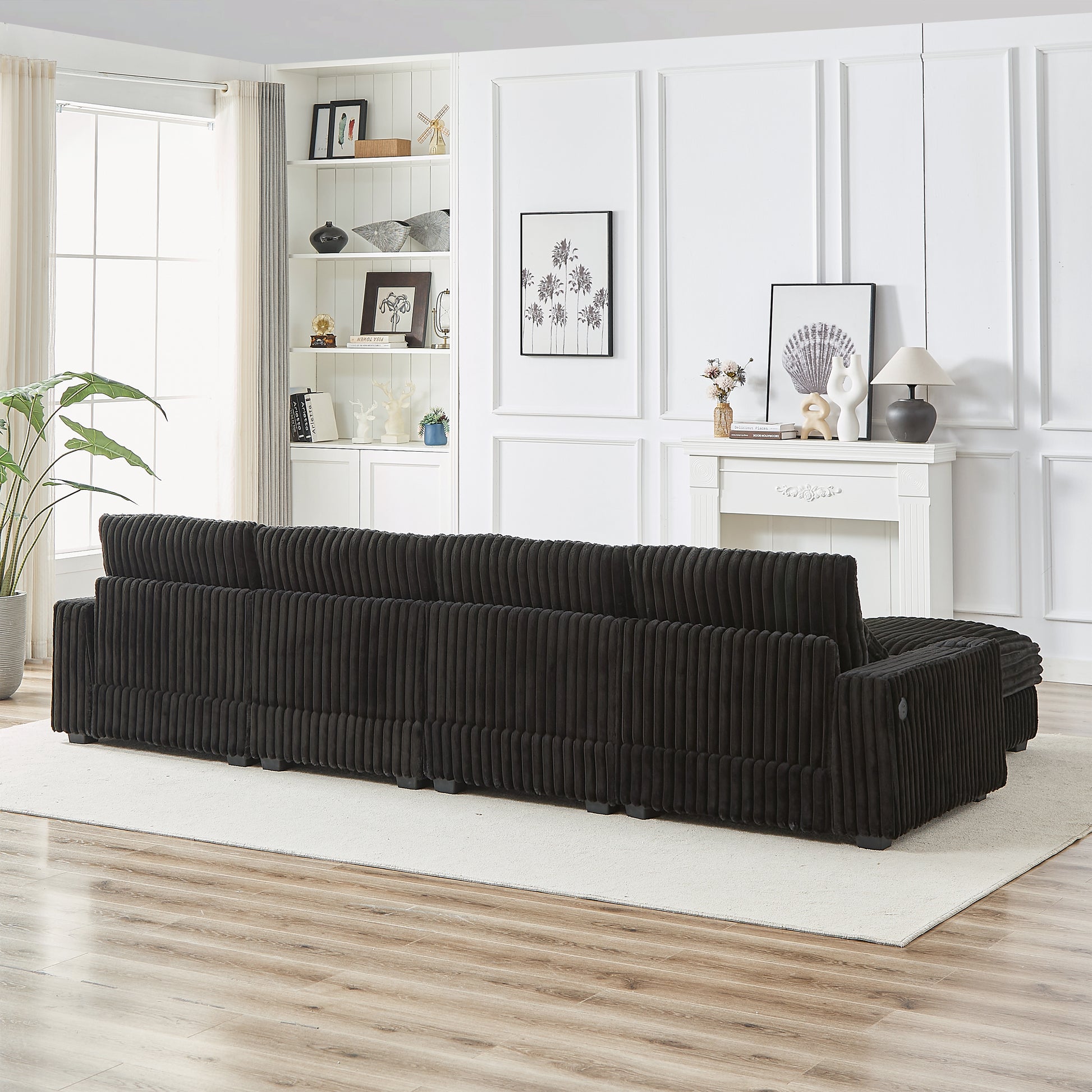 Dark charcoal corduroy sectional sofa with wide plush cushions and clean lines