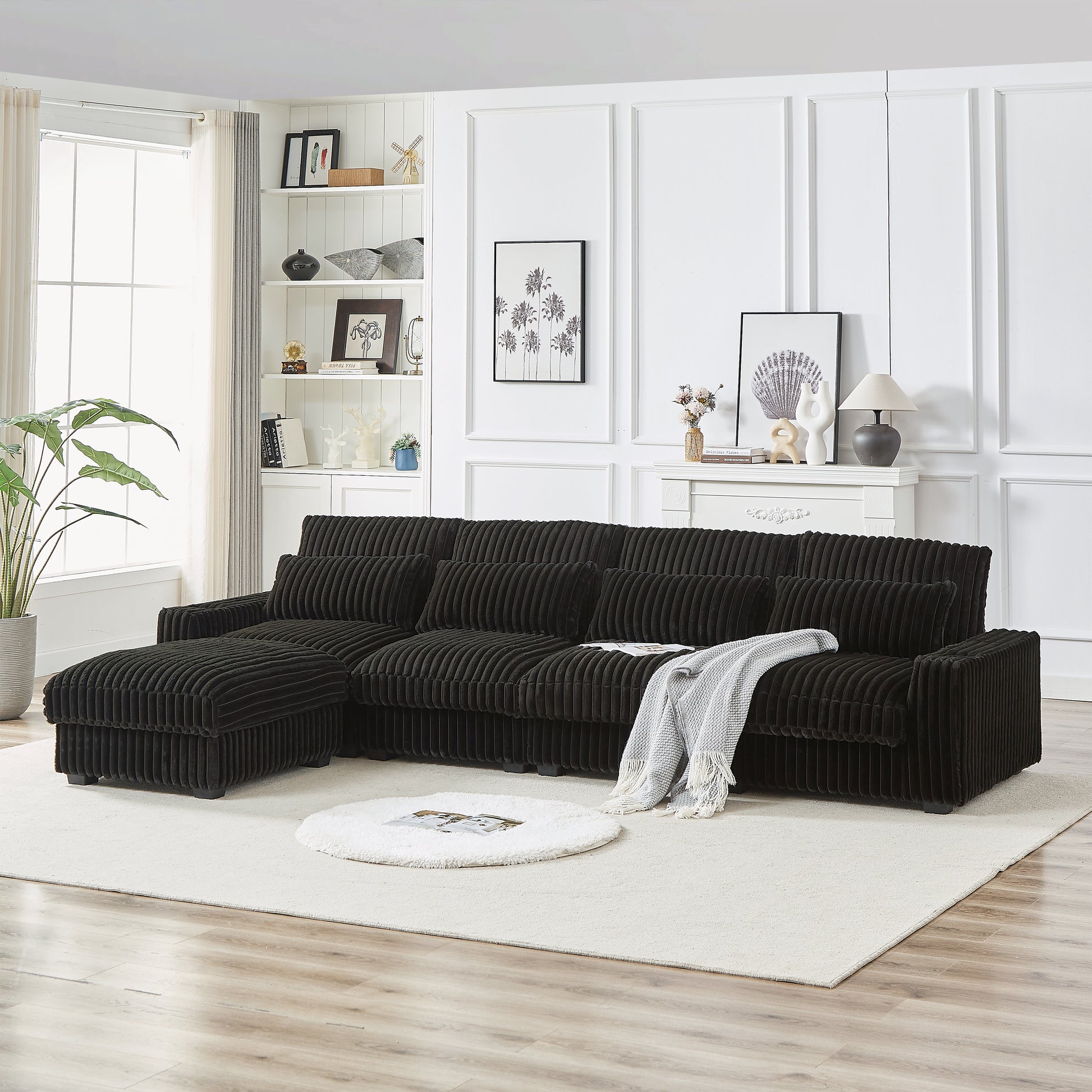 Dark brown corduroy sectional sofa with plush cushions and an ottoman modern living room furniture