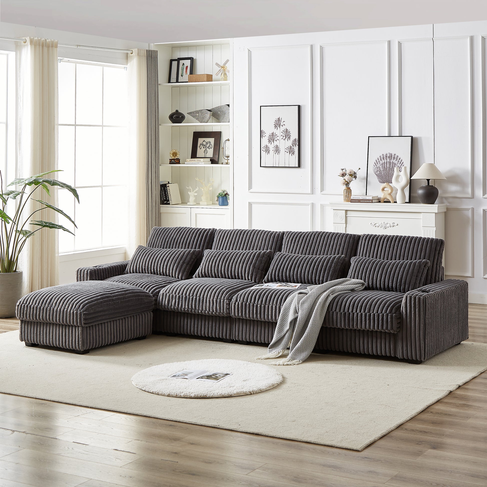 Dark gray corduroy sectional sofa with chaise and ottoman modern living room style