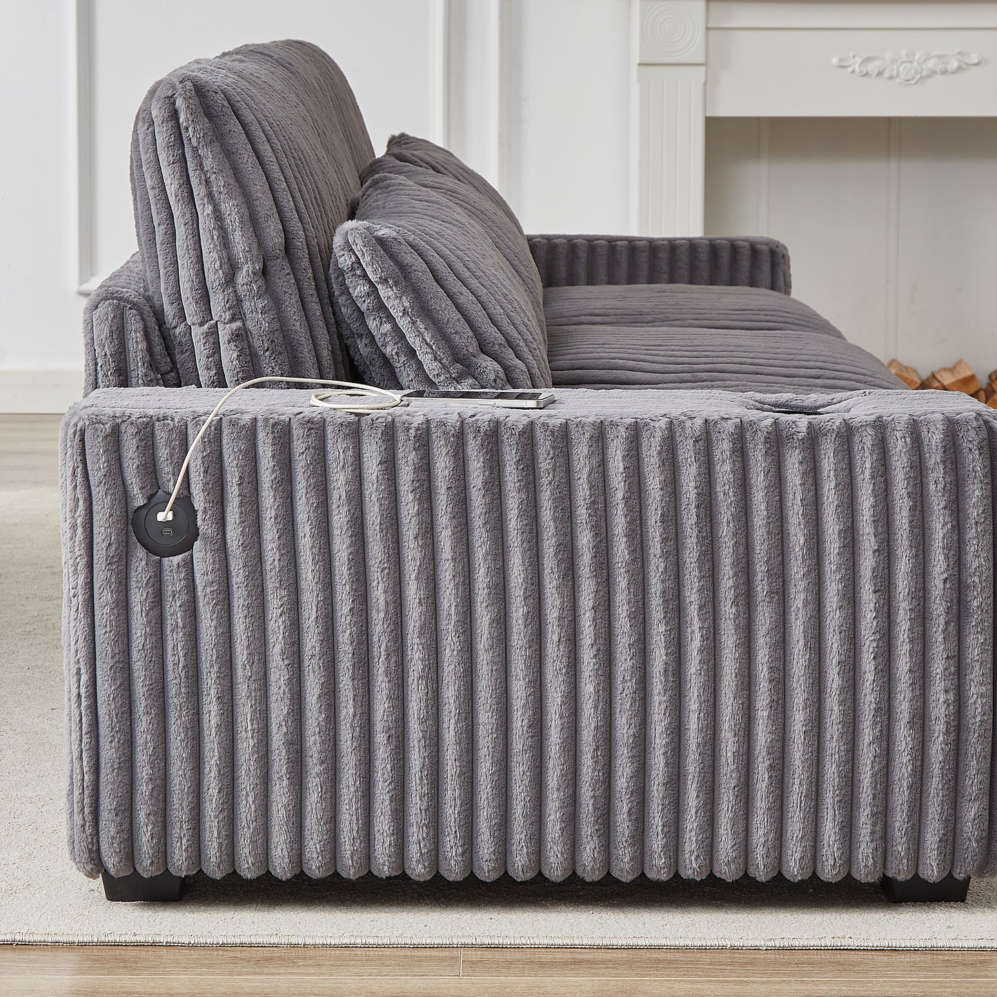 Plush grey corduroy armchair with integrated USB charging port and side pocket for modern living