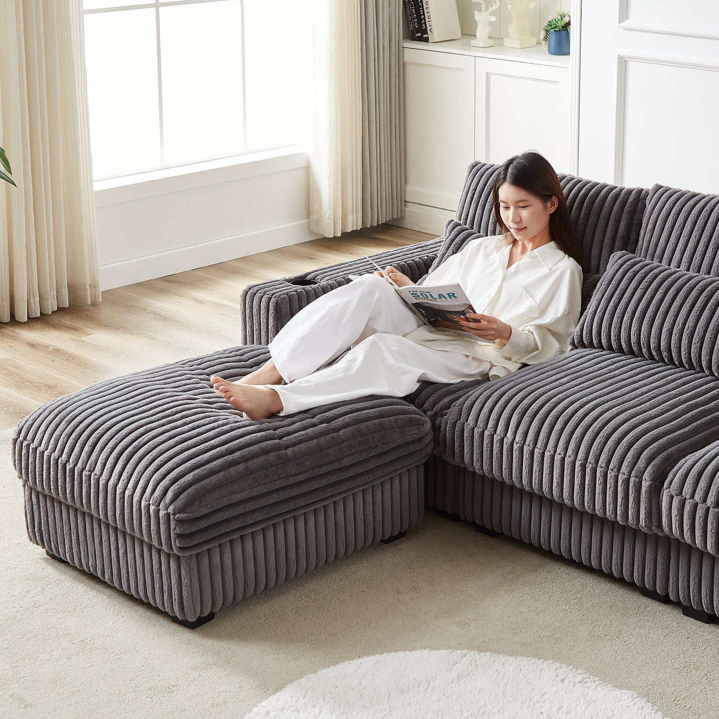 Plush grey corduroy sectional sofa with a chaise lounge perfect for modern living rooms