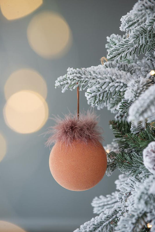 Fluffy rose gold Christmas ornament with textured peach sphere and soft feather trim