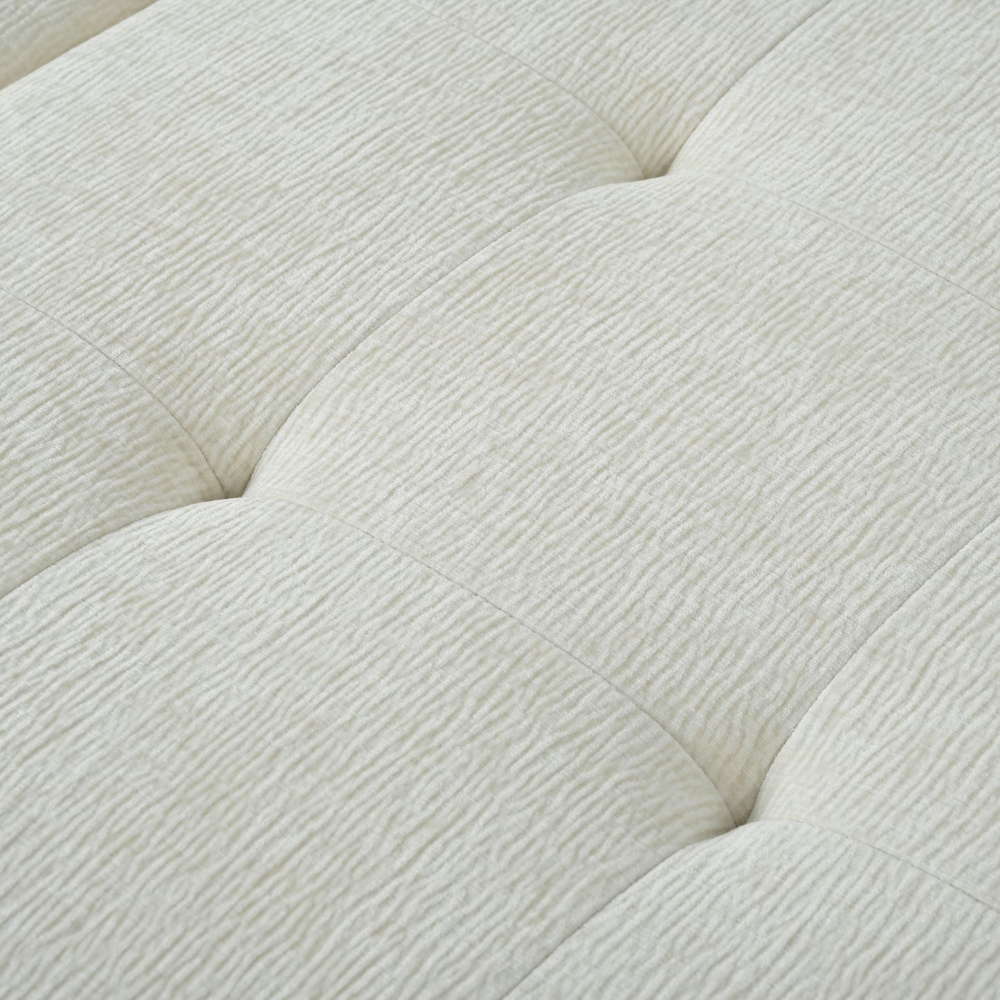 Closeup of tufted ivory textured fabric ideal for modern upholstery projects