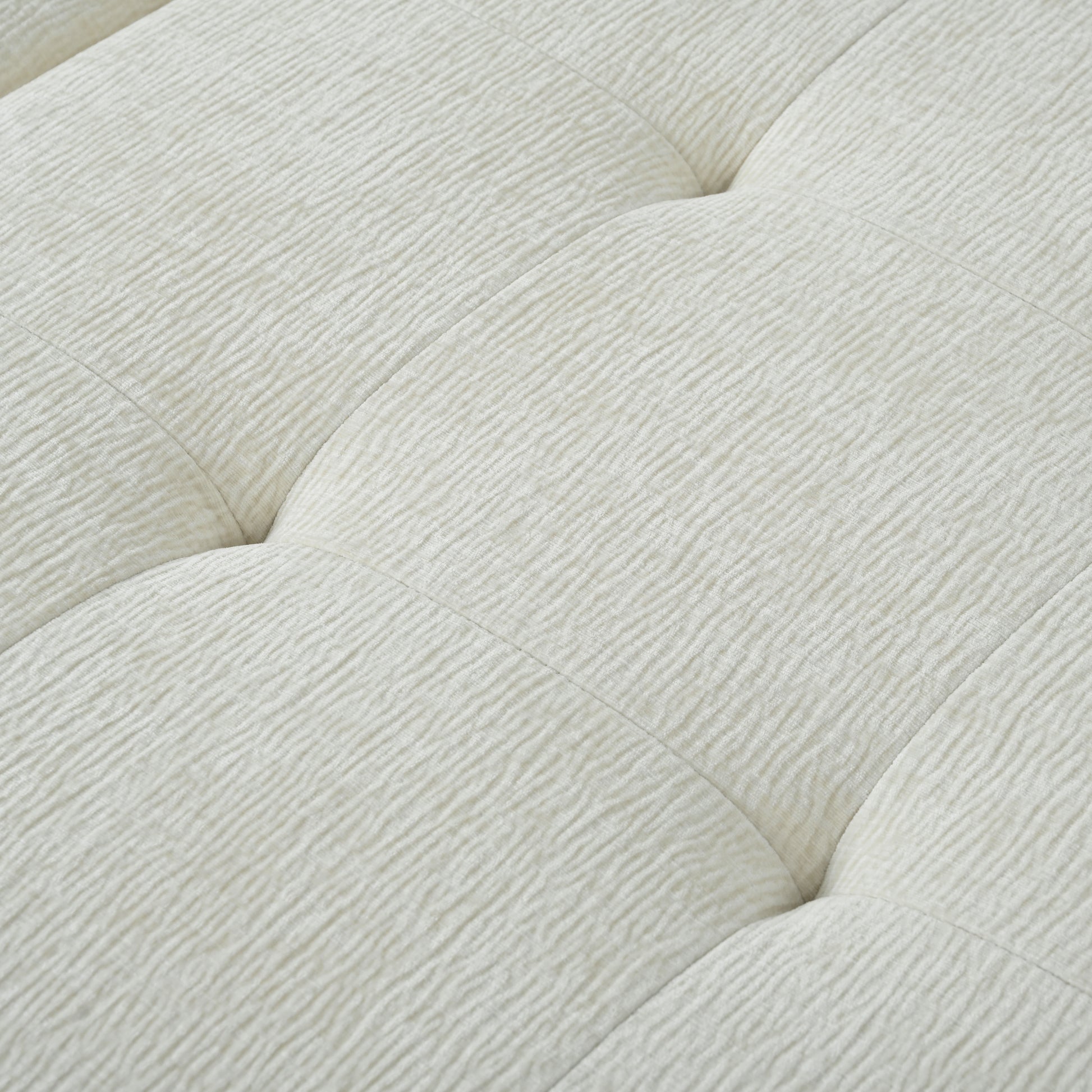 Closeup of tufted ivory textured fabric ideal for modern upholstery projects
