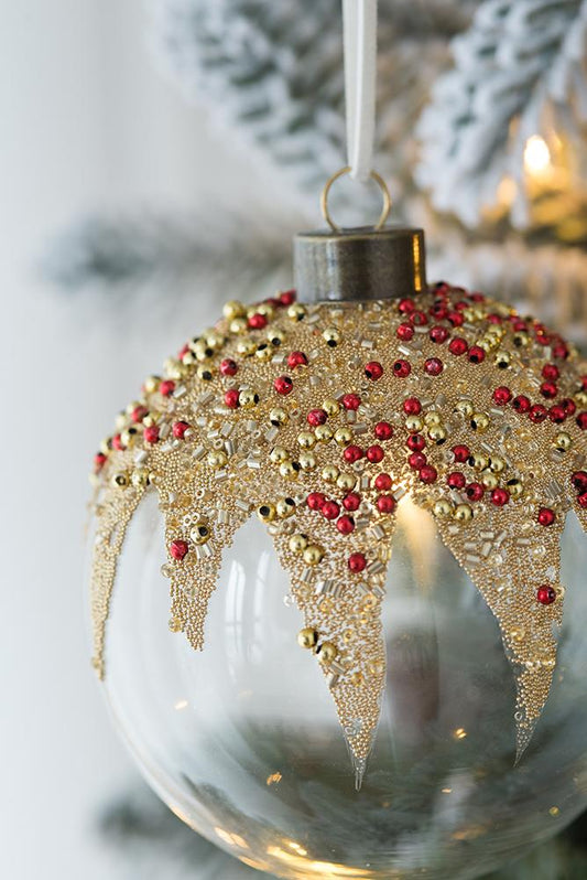 Clear glass Christmas ornament with beaded gold and red accents
