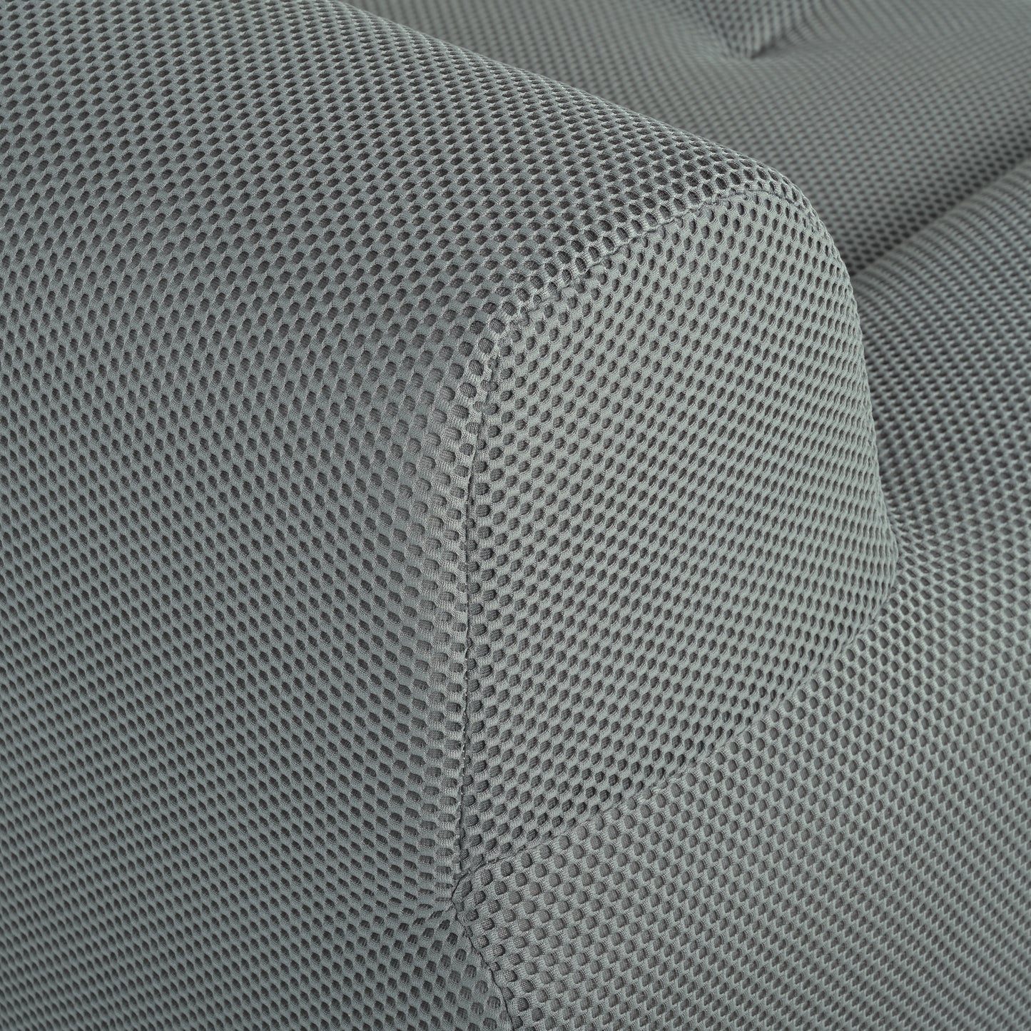 Closeup of a grey breathable mesh fabric with a distinctive hexagonal pattern ideal for upholstery