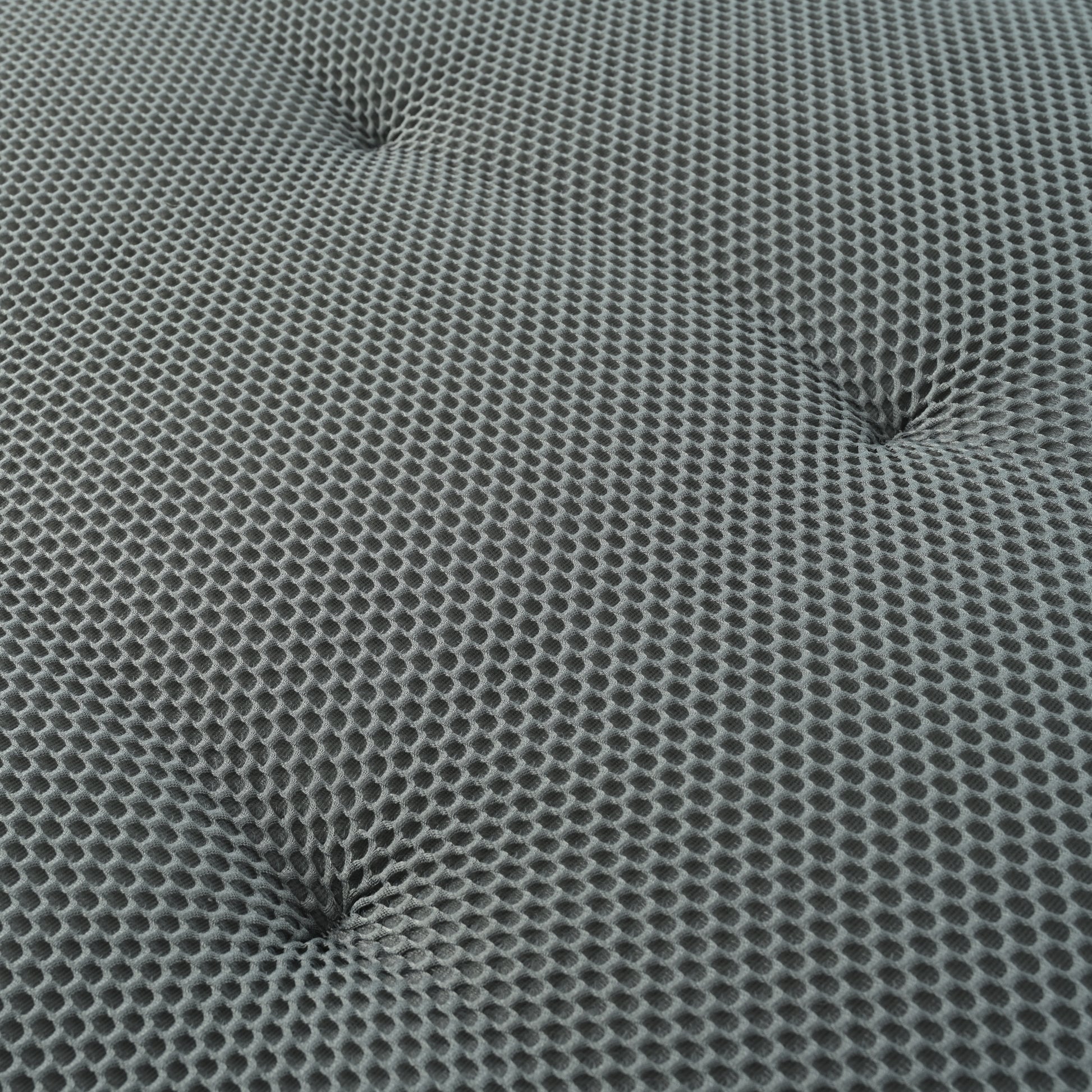 Gray hexagonal mesh fabric with tufted accents ideal for upholstery or bedding