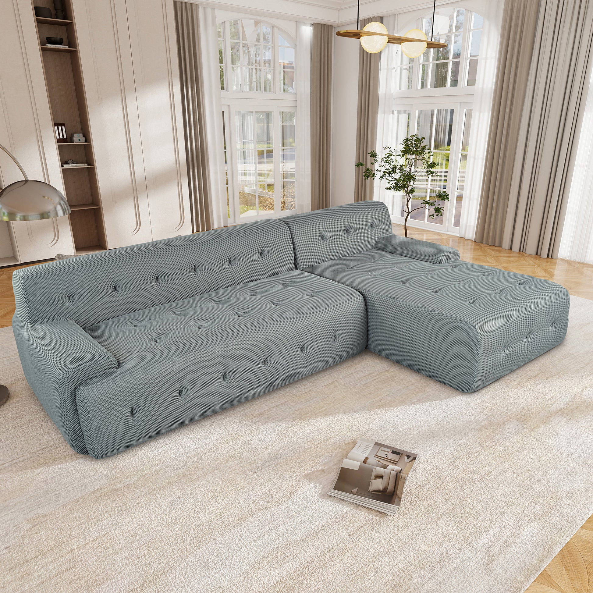 Light blue sectional sofa with tufted cushions and modern geometric fabric perfect for living rooms