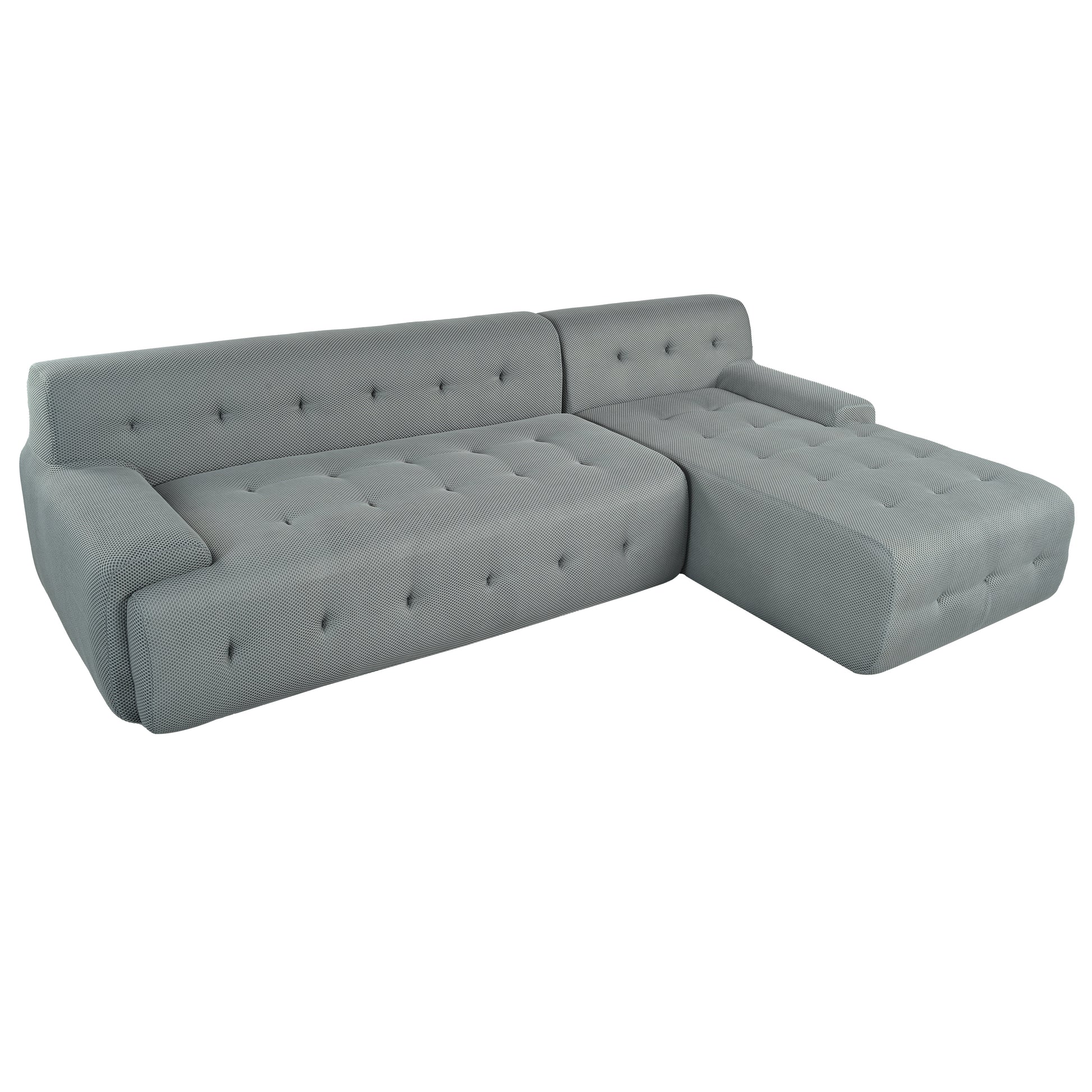 Modern gray sectional sofa with tufted cushions and textured fabric perfect for living rooms