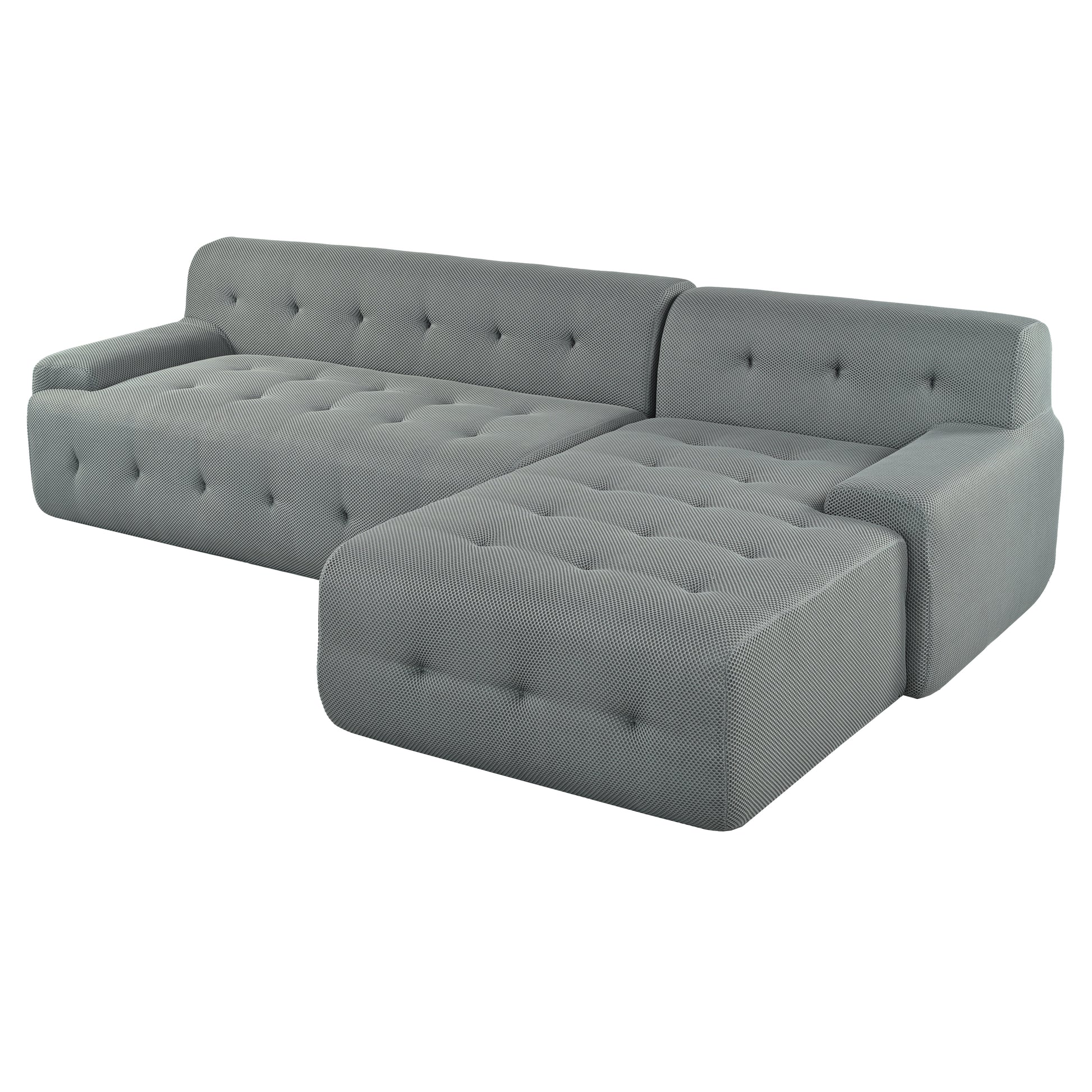 Modern grey sectional sofa with tufted cushions and a textured fabric finish