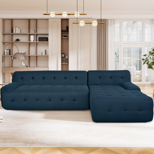Deep navy sectional sofa with tufted cushions and textured fabric ideal for modern living rooms
