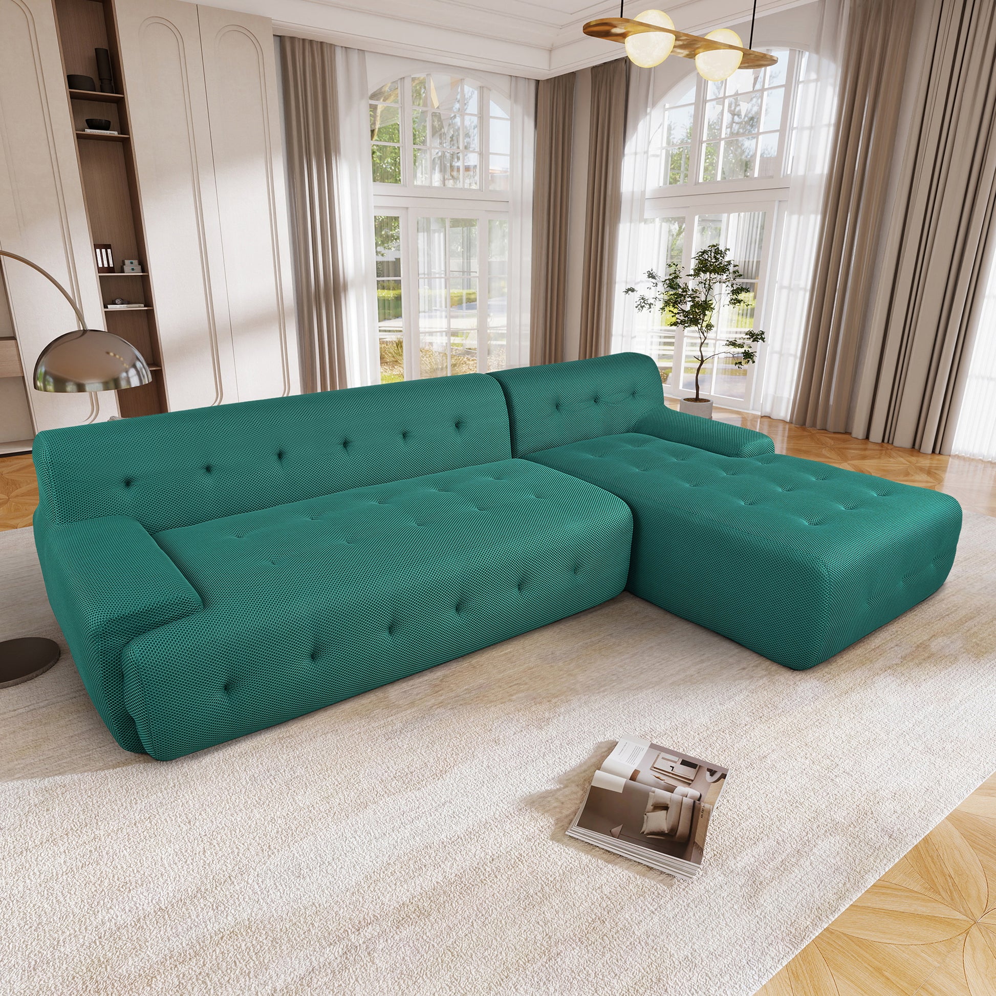 Teal sectional sofa with tufted cushions and a textured fabric finish