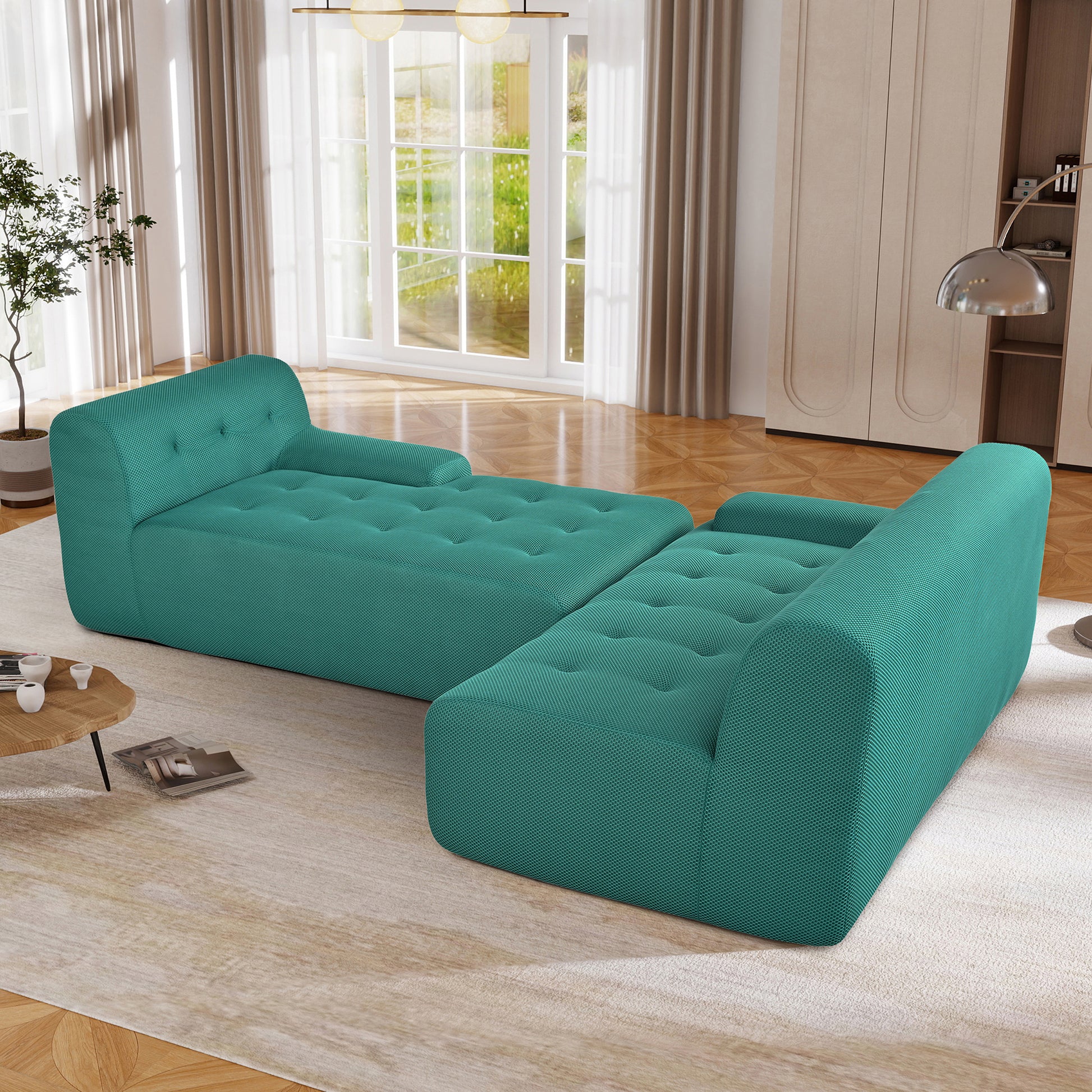 Teal modular sofa with tufted cushions and sleek modern design