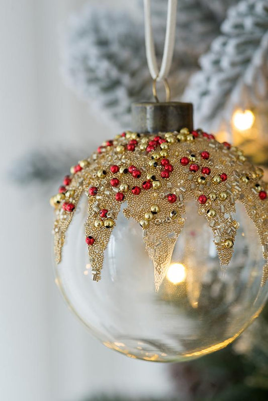 Clear glass Christmas ornament with gold bead and red jewel accents