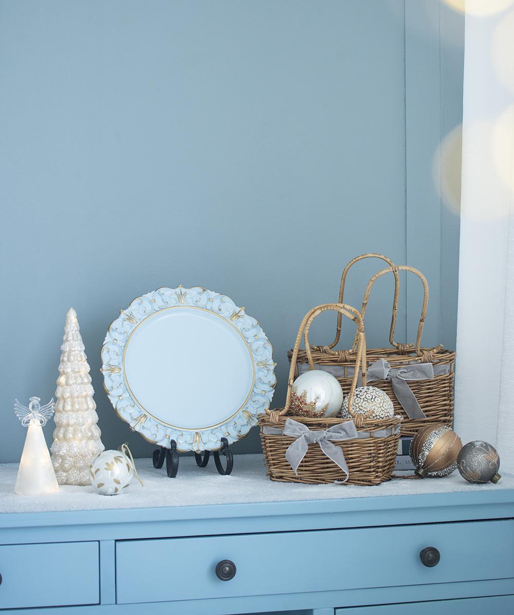 White decorative Christmas tree with fairy lights and angel topper