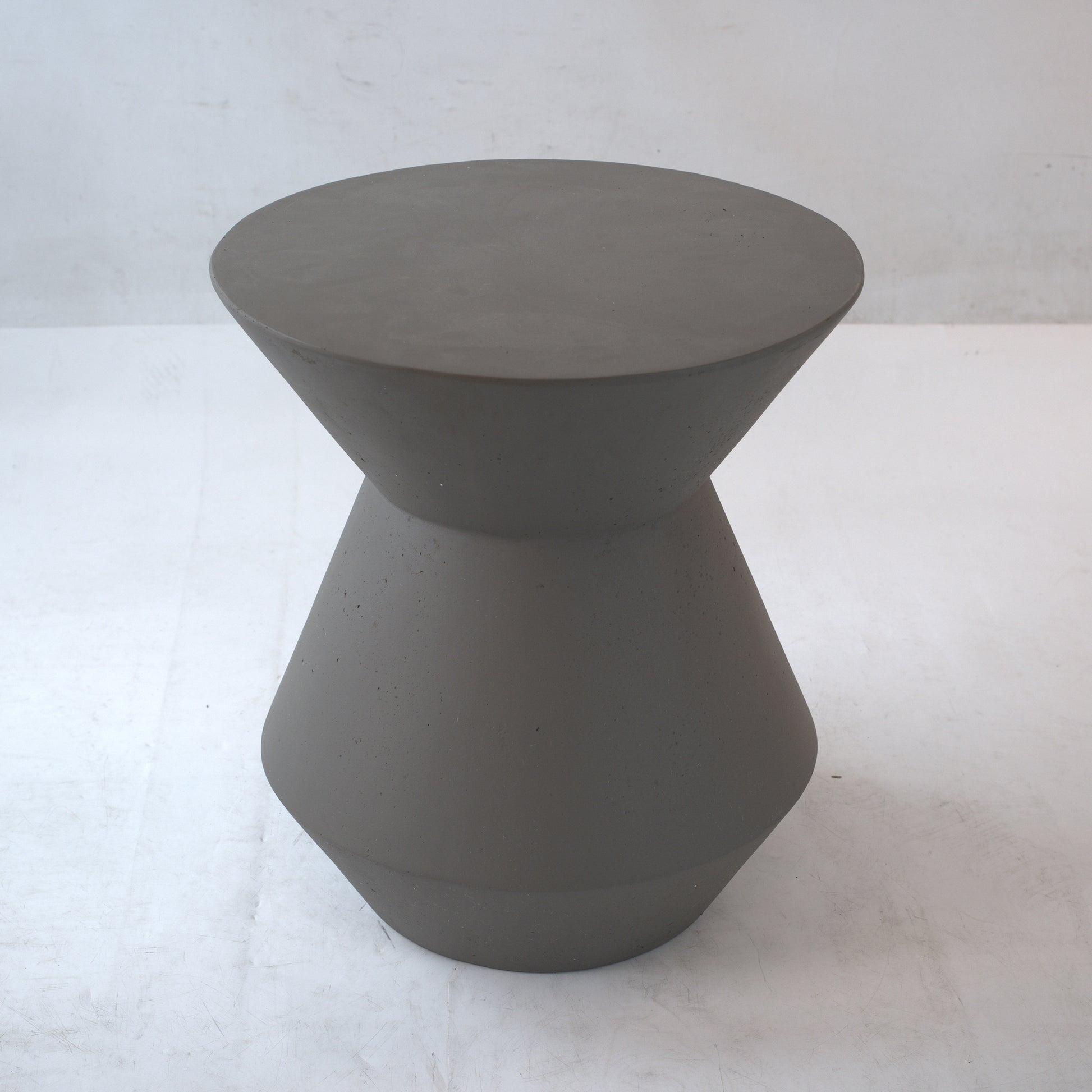 Modern grey concrete hourglass stool  inch height perfect for indoor or outdoor seating