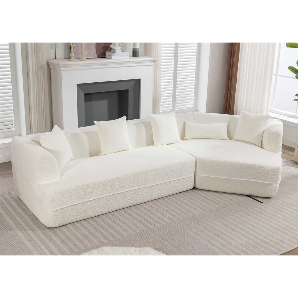 Plush cream sectional sofa with matching throw pillows perfect for modern living rooms