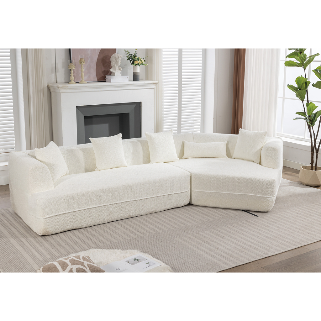 Plush ivory sectional sofa with textured fabric and matching throw pillows