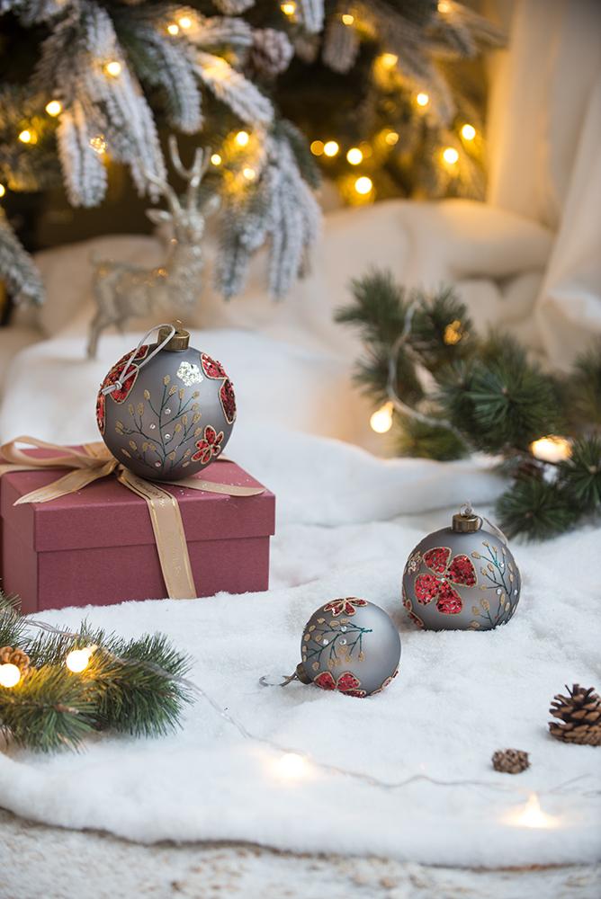 Elegant grey Christmas ornament with red floral detail and gift box