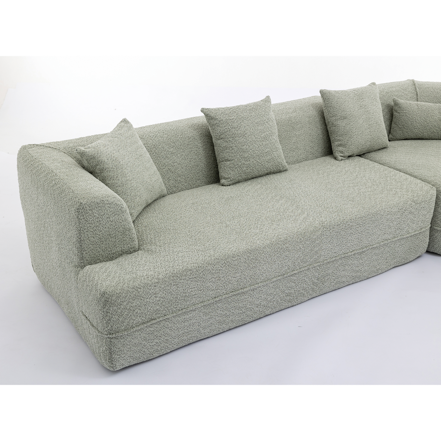 Light green textured fabric sectional sofa with plush cushions perfect for modern living rooms