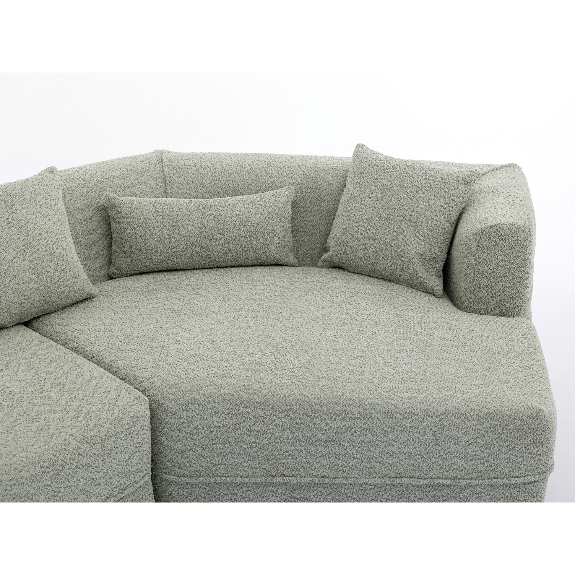 Soft sage boucle fabric sectional sofa with multiple plush cushions for ultimate comfort