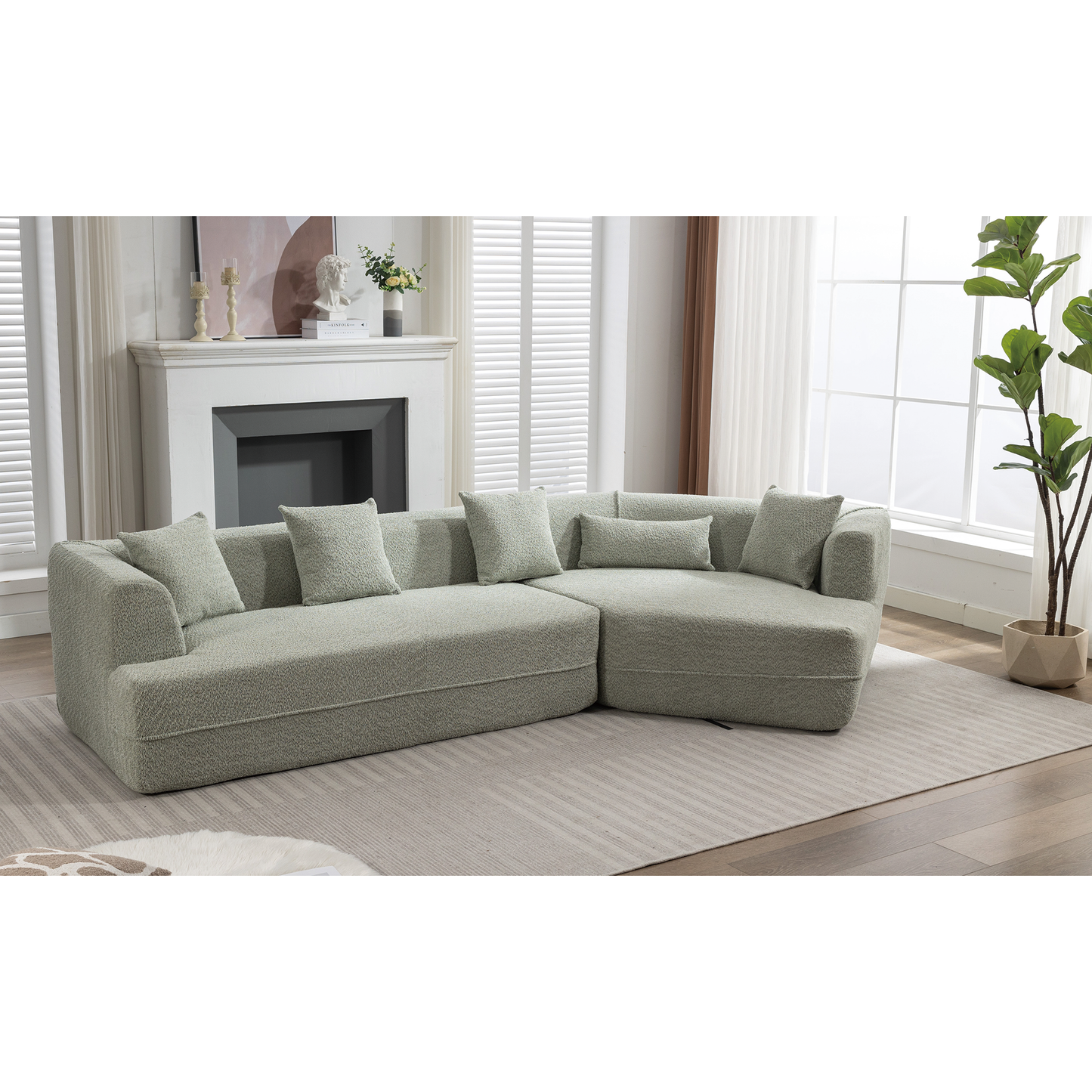 Sage green boucle sectional sofa with plush throw pillows modern living room design