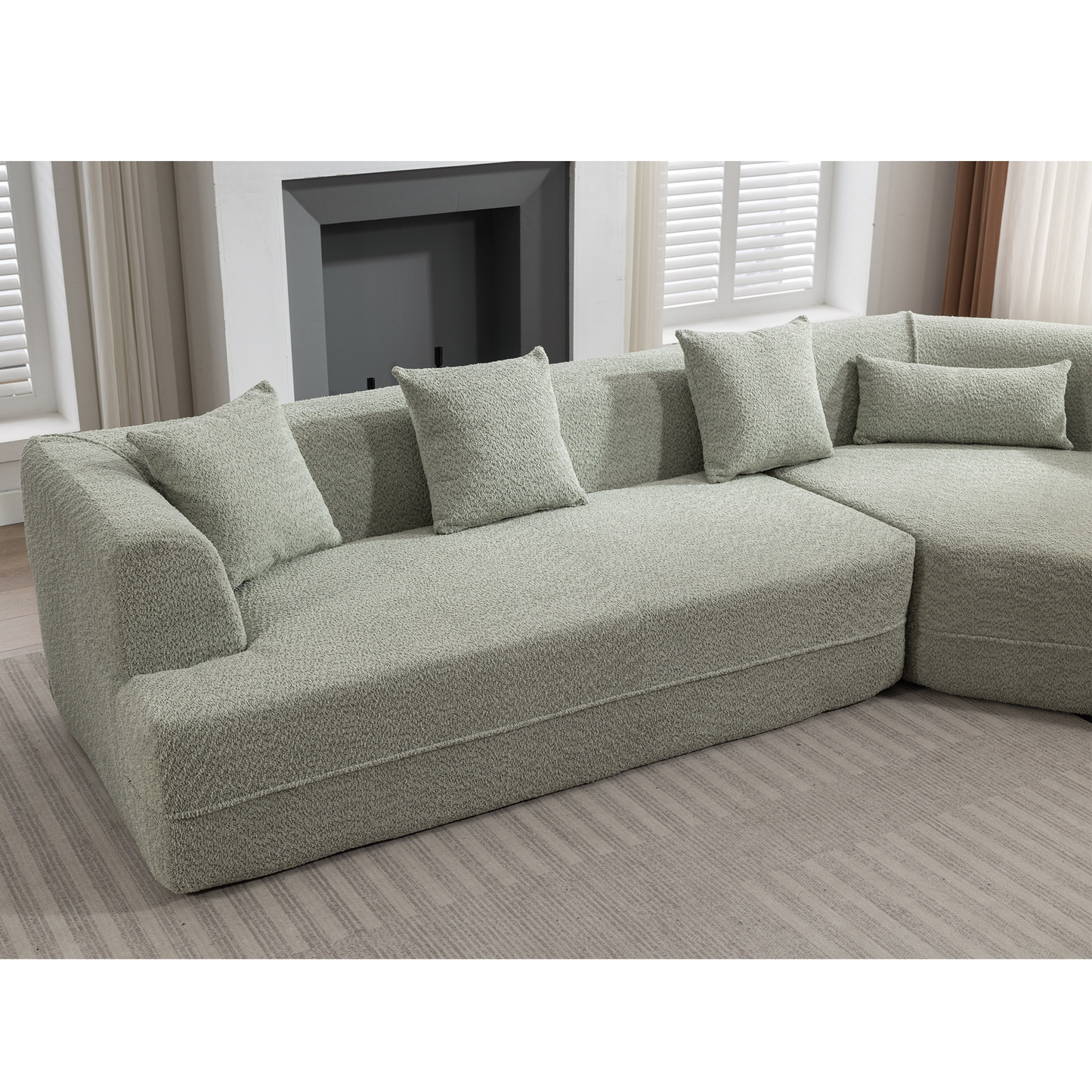 Sage green boucle fabric sectional sofa with plush cushions