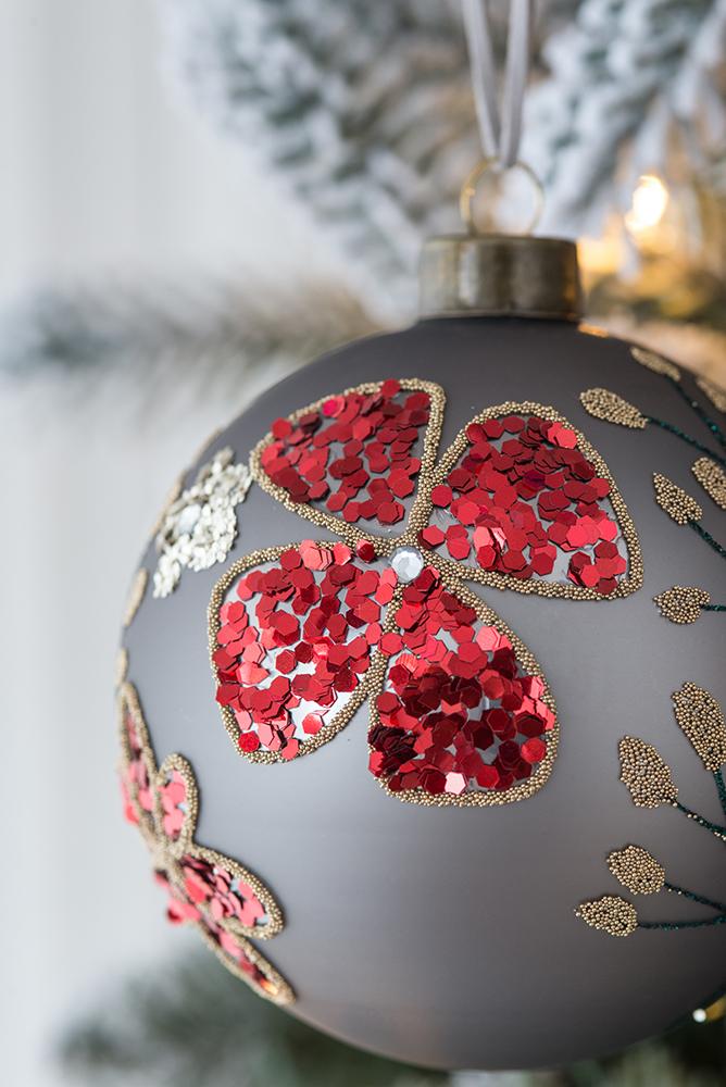 Grey glass Christmas ornament with red sequin flower and beaded details