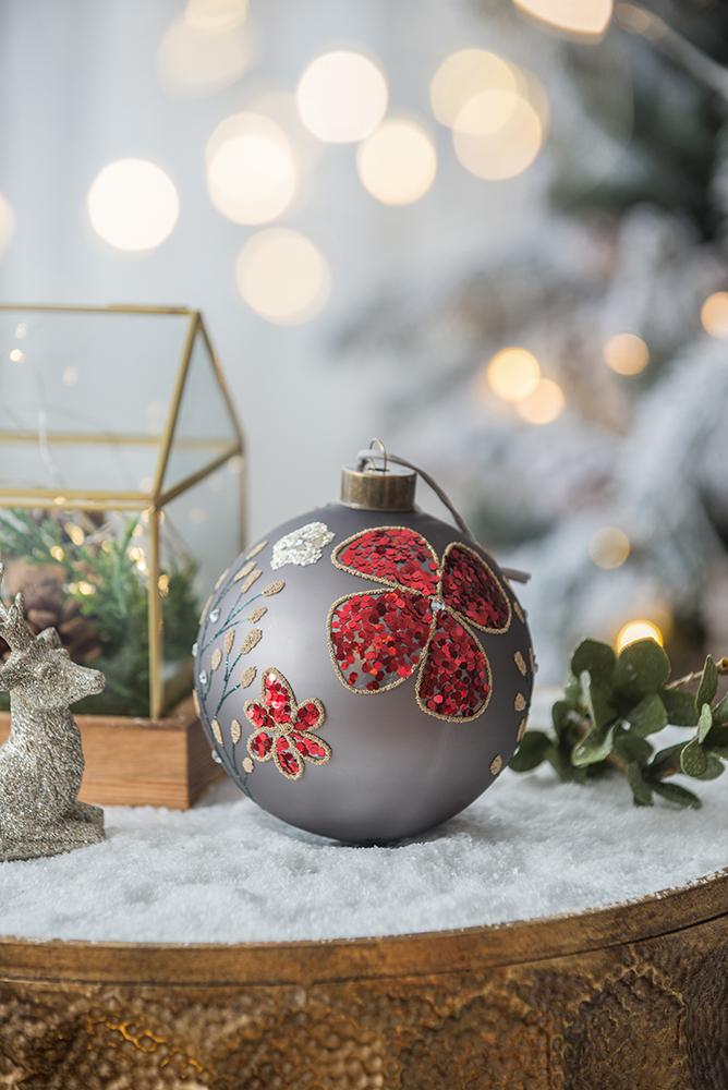 Gray Christmas bauble with red sequin flowers and glittery branches