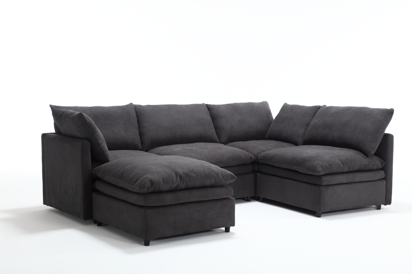 Deep charcoal sectional sofa with plush cushions for a modern living room