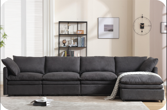Deep charcoal grey modular sectional sofa with plush cushions and chaise lounge