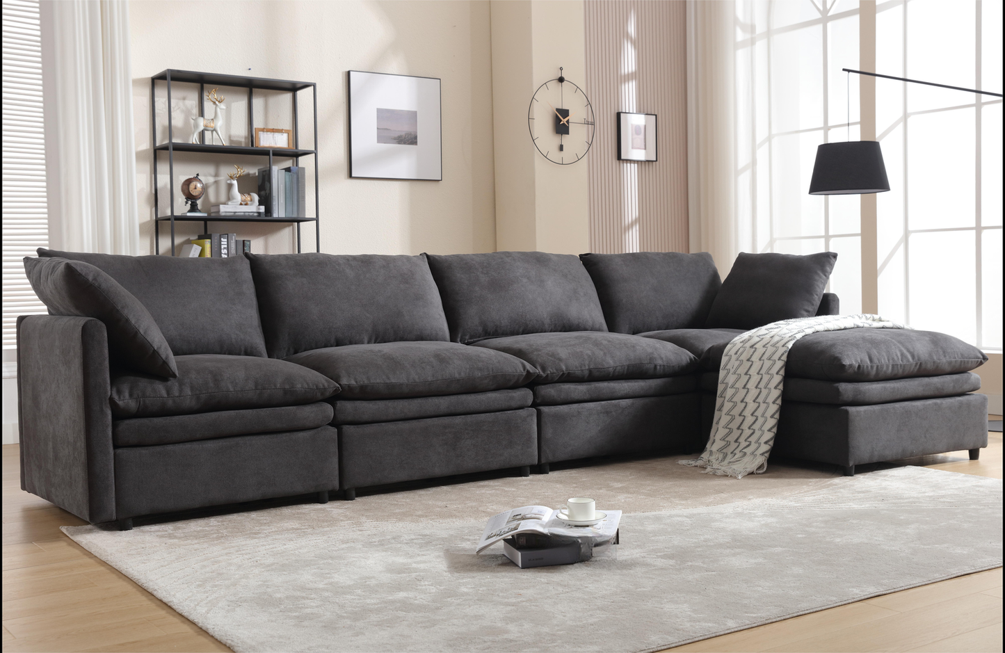 Dark gray fabric sectional sofa with plush cushions and chaise lounge
