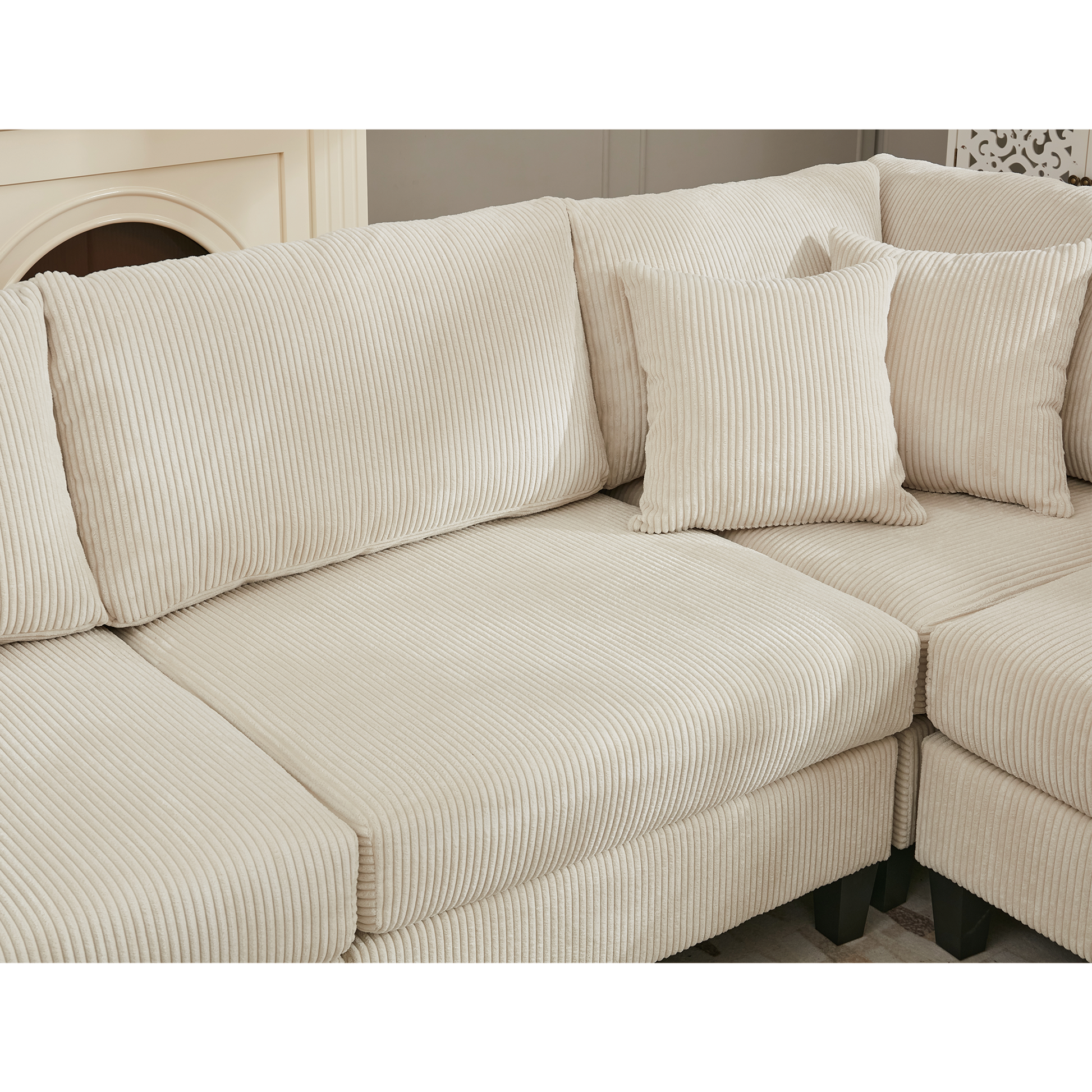 Cream corduroy sectional sofa with plush cushions and deep seating for comfort
