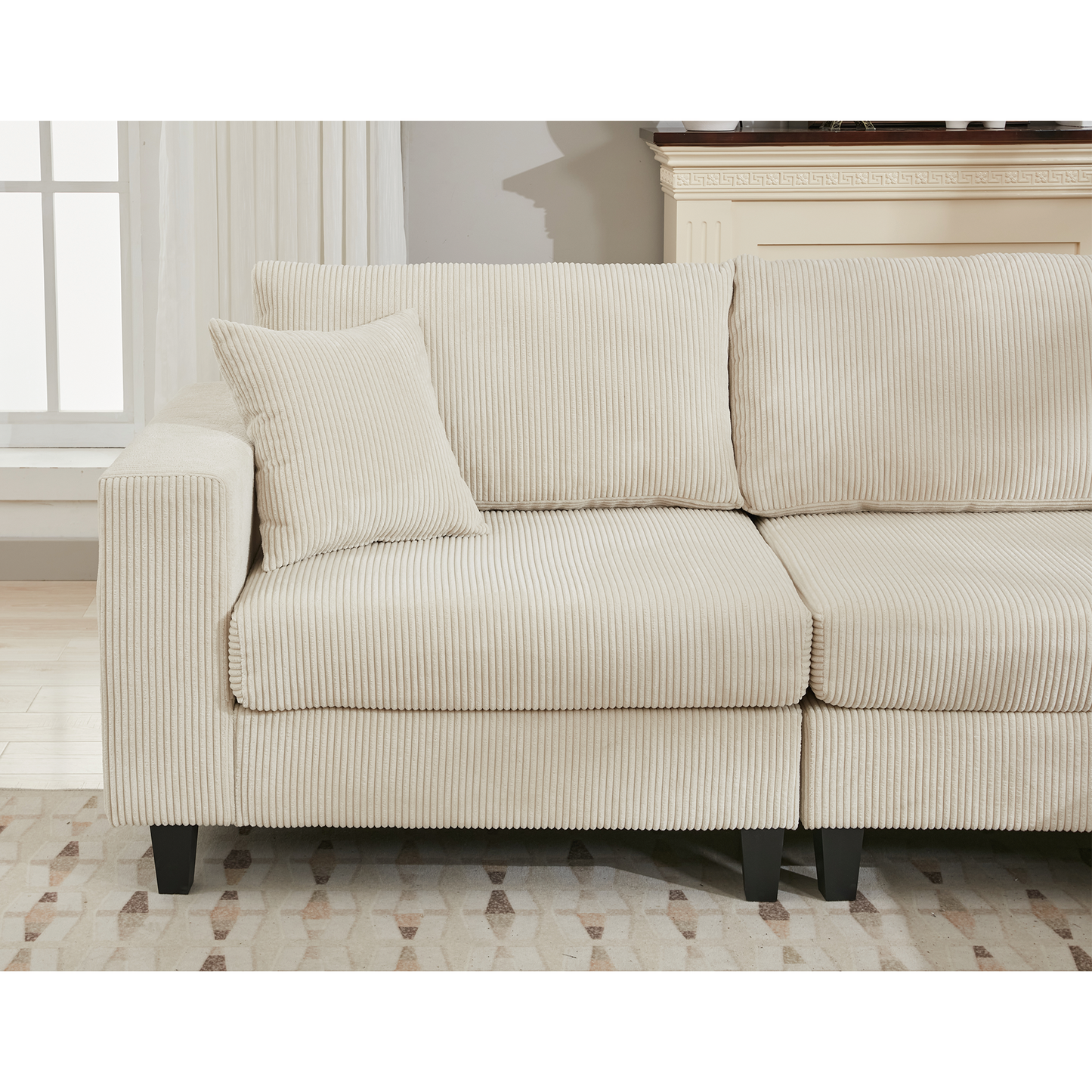 Cream corduroy sectional sofa with plush cushions and dark wooden legs ideal for modern living rooms