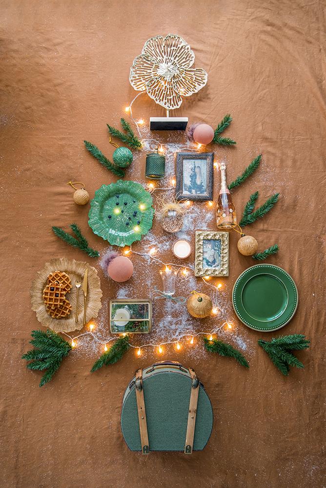 Gold decorative tabletop centerpiece with intricate floral design and warm LED lights