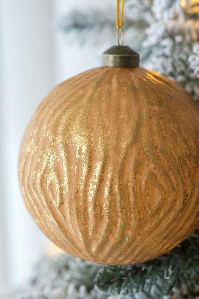 Golden woodgrain textured Christmas ornament with glitter accents