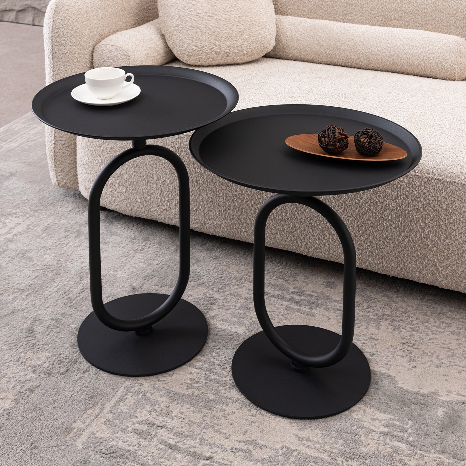 Modern black metal accent tables with oval bases perfect for living room decor