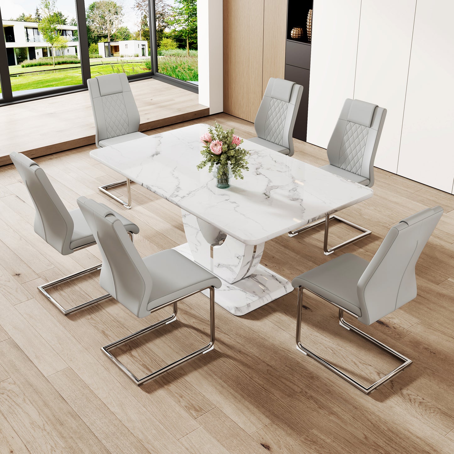 Marble dining table with six grey upholstered chairs with chrome legs