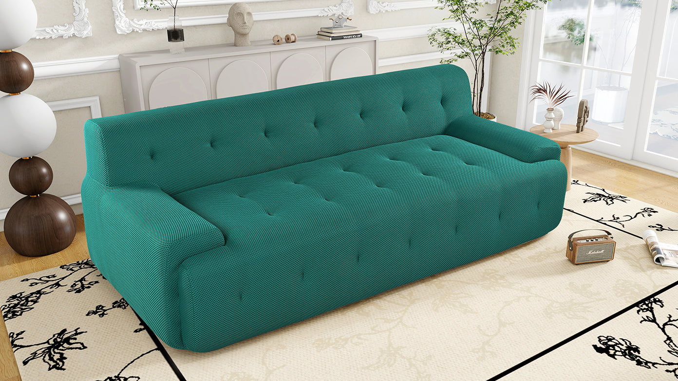 Teal tufted sofa with textured fabric a stylish and comfortable living room centerpiece