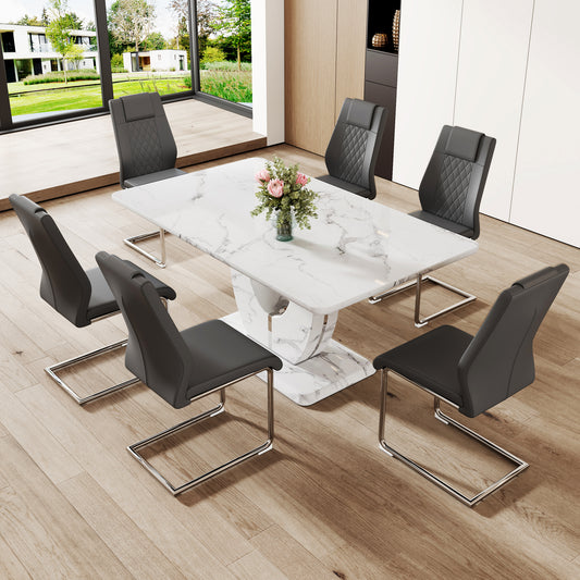 Marble dining table with upholstered diamondstitched grey chairs around it