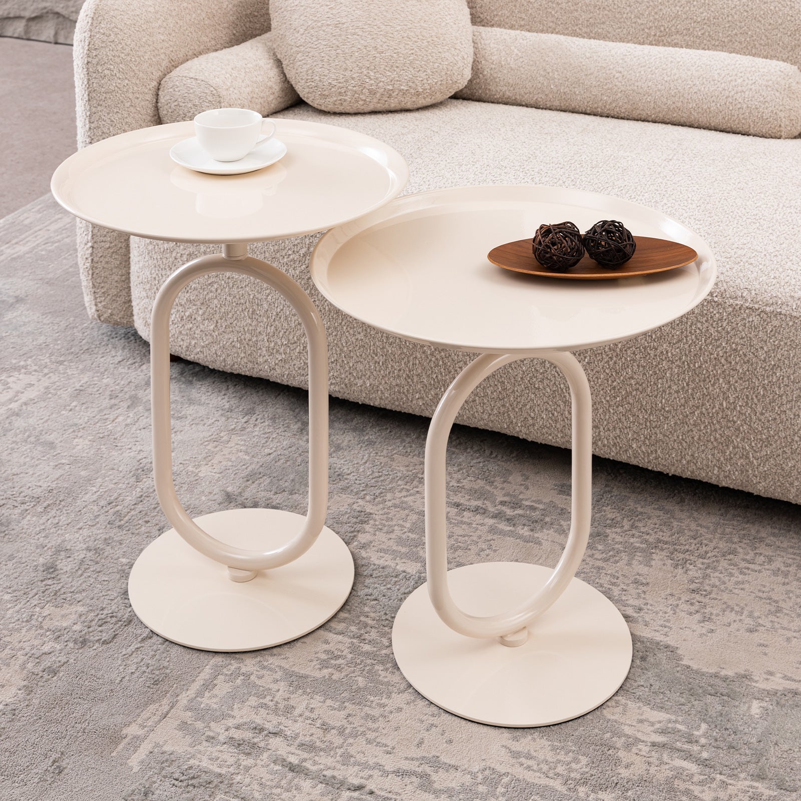 Minimalist cream end table with oval metal base and round tray top
