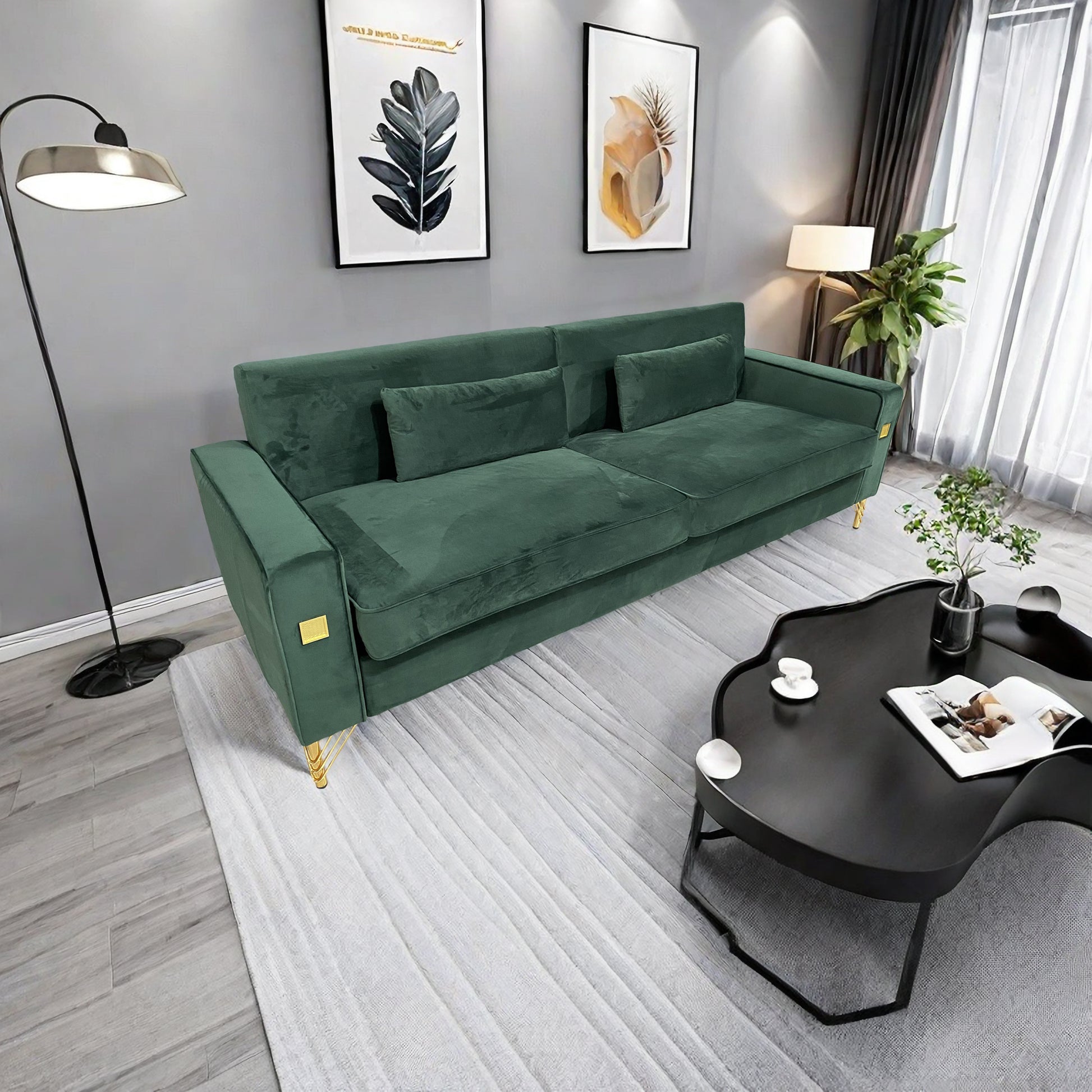 Deep green velvet sofa with plush cushions and gold accents perfect for living room comfort
